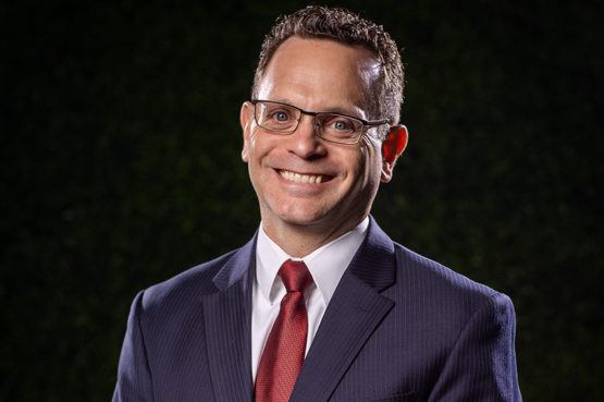 Lawrence Elmen smiling in headshot